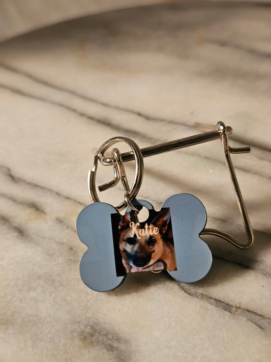 Small Dog tag with your dog picture on front and the owner's name and phone number on back