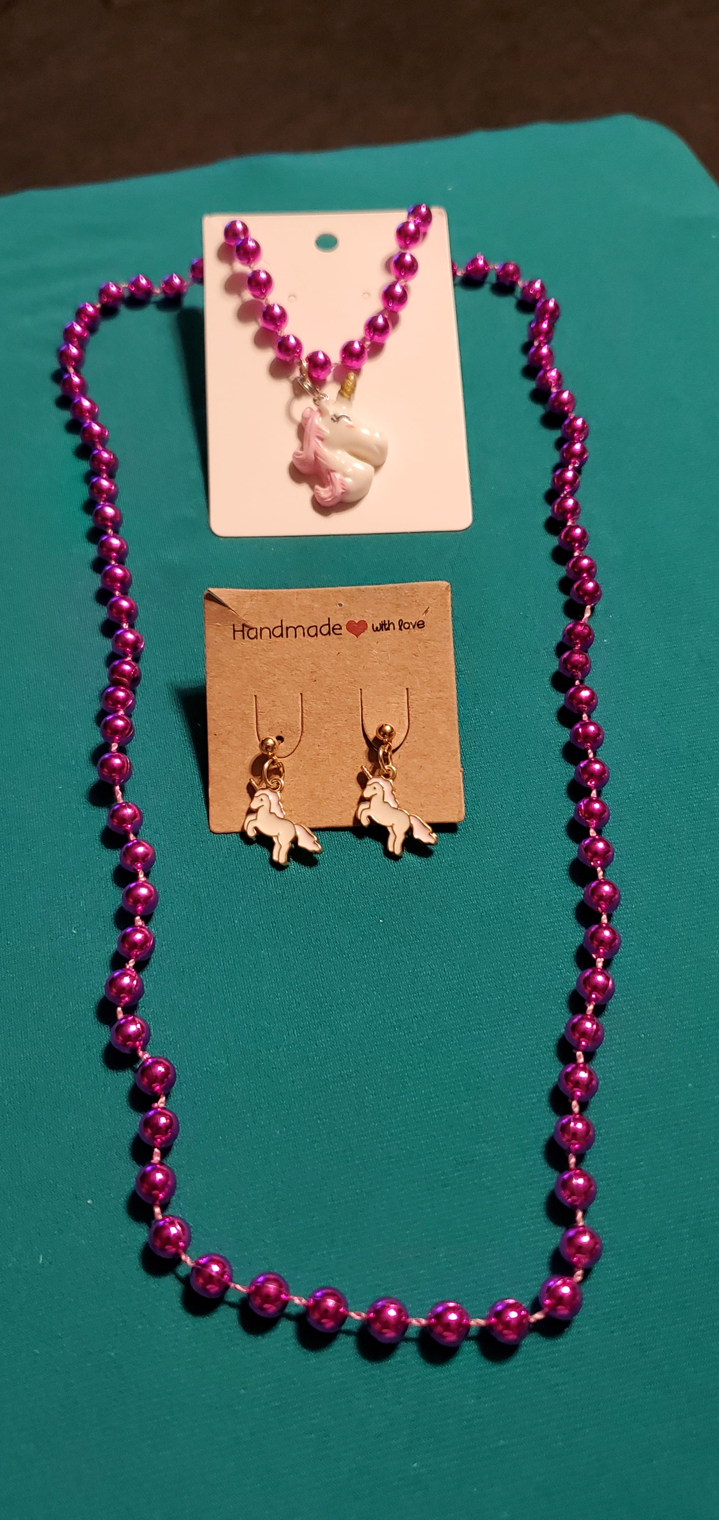 Pink & White unicorn on a pink beaded necklace and earrings