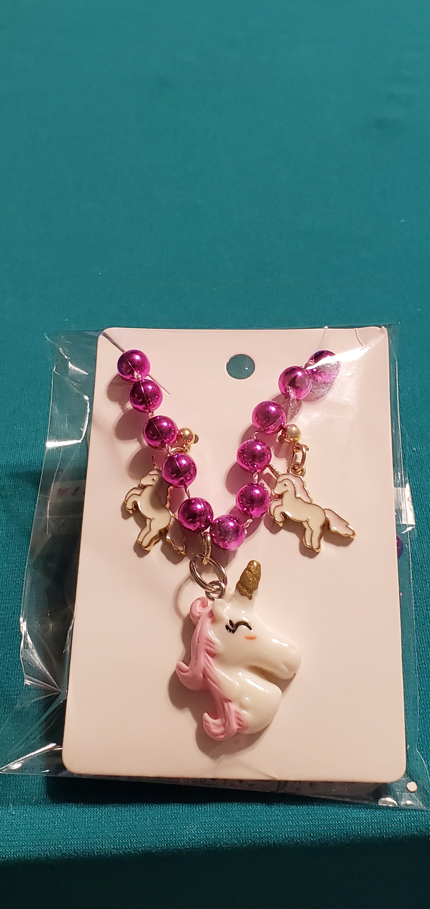 Pink & White unicorn on a pink beaded necklace and earrings