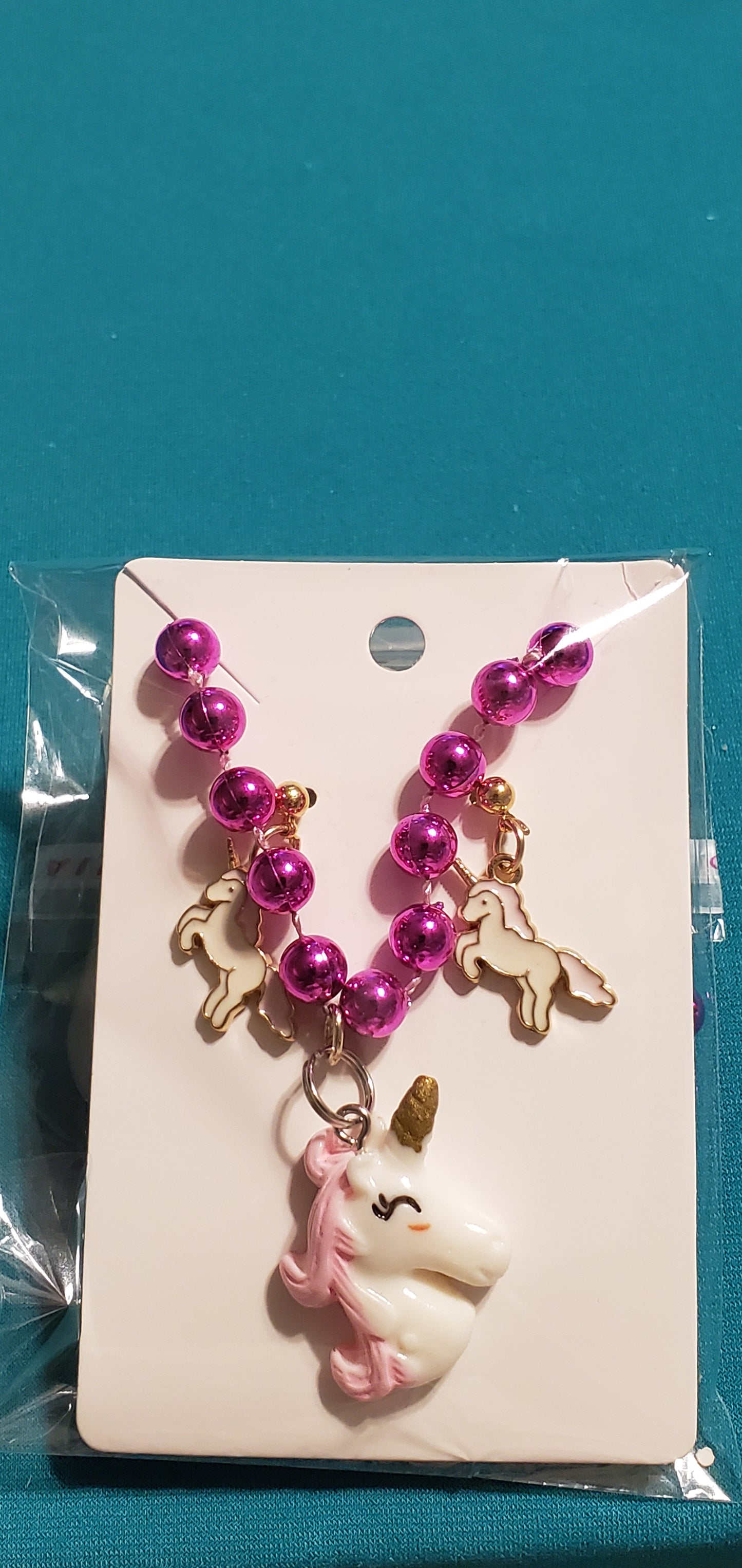 Pink & White unicorn on a pink beaded necklace and earrings