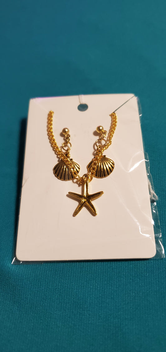 Gold plated star necklace and sea shell earrings